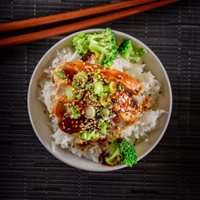 Top down photo of a teriyaki chicken dish served with rice